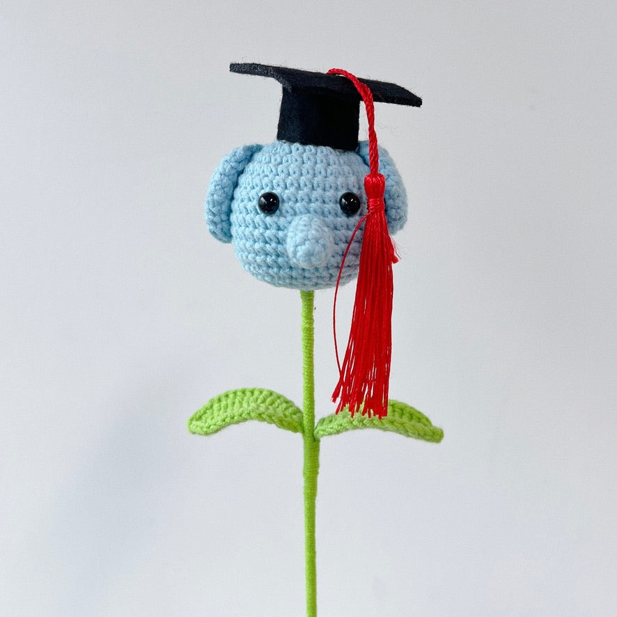 crochet cartoon character animal single stalk flower blue elephant with mortarboard