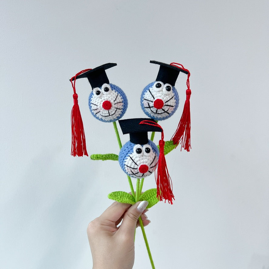 crochet cartoon character animal single stalk flower doraemon with mortarboard