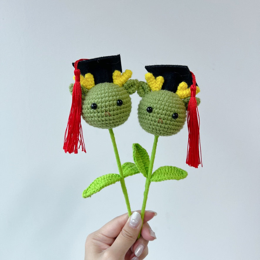 crochet cartoon character animal single stalk flower green dragon with mortarboard